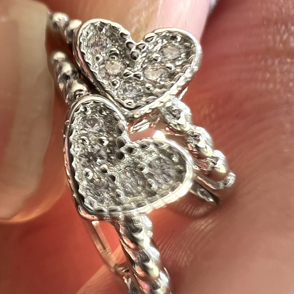 Item 1 - Sterling silver heart shaped hoop earrings with cubic zirconia inset
